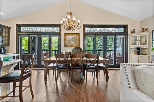 a dining room with a table and chairs at Niagara Creekside B&B - Waterfront suite in Niagara Falls