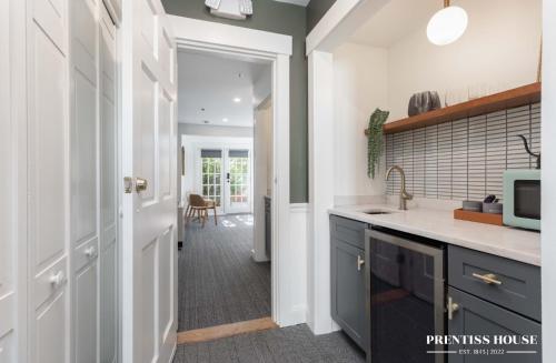 a kitchen with a sink and a counter at Prentiss House by Thatch in Cambridge