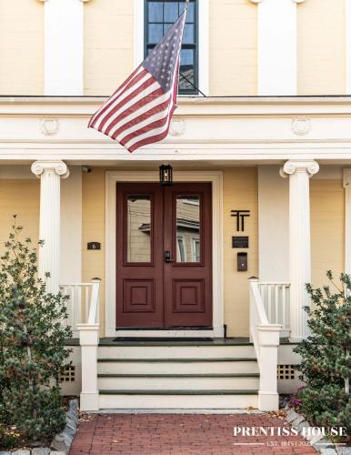 an american flag on the front of a house at Prentiss House by Thatch in Cambridge