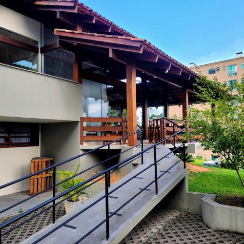 an external view of a building with a balcony at Blu Hostel in Blumenau