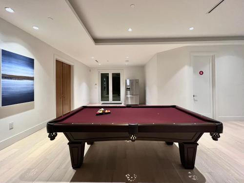 a pool table in the middle of a room at Cozy&Private Suite in Vancouver in Vancouver