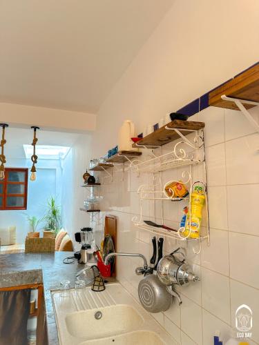 a kitchen with a sink and a counter at Eco Bay Surf House in Agadir