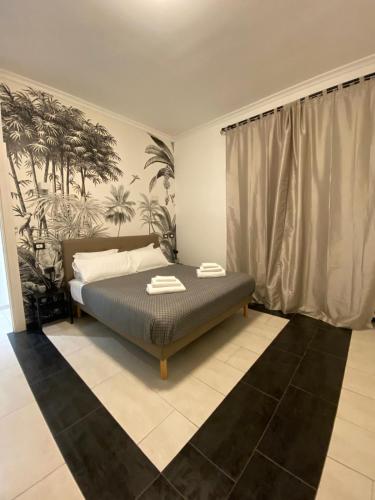a bedroom with a bed in a room at Espero Ostia in Lido di Ostia