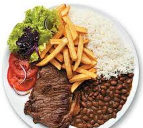 a plate of food with beans rice and broccoli at Acacia hotel in Laguna