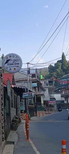 a street with a sign on the side of the road at Ang Ds Homestay in Sonāda