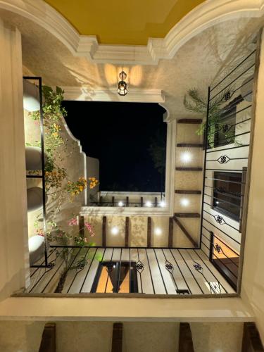 a room with a balcony with a large window at Casa grande de lujo cerca Antigua Guatemala in Antigua Guatemala