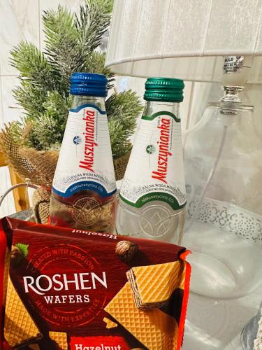 two bottles of water sitting in a refrigerator at Domek Golasówka in Muszyna