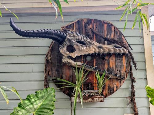 a mask of an animal on the side of a building at Cozy AF Tiny-House Oasis in Tampa