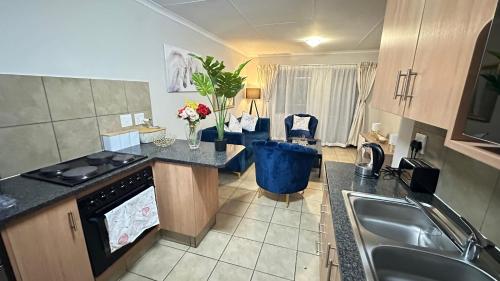 a kitchen with a sink and a counter top at Nyasa Apartment in Johannesburg