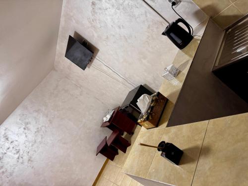 an overhead view of a living room with tables and chairs at Home Efrem in Bucharest