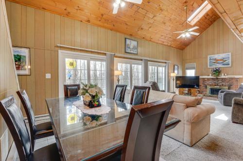 a dining room with a glass table and chairs at Near Hiking and Skiing Home in Wilmington! in Wilmington