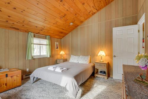 a bedroom with a bed and a wooden ceiling at Near Hiking and Skiing Home in Wilmington! in Wilmington