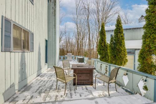 a patio with chairs and a table on a balcony at Near Hiking and Skiing Home in Wilmington! in Wilmington
