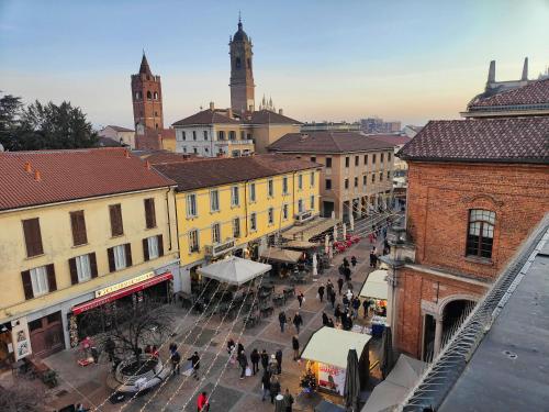 a group of people walking around a city street at Locanda San Paolo in Monza