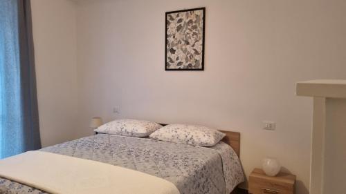 Postel nebo postele na pokoji v ubytování La Piccola Dimora Nel Borgo