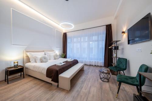 a bedroom with a bed and a living room at Hama Boutique Stays in Budapest