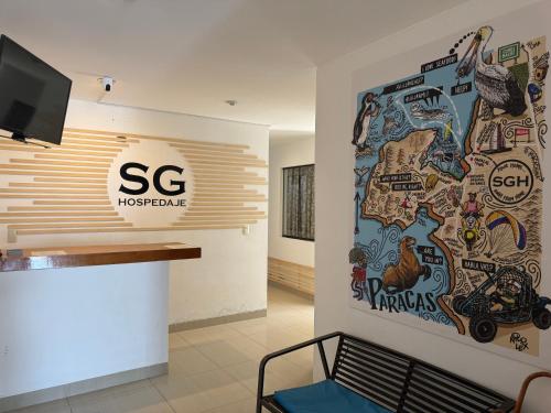 a lobby of a hospital with a wall covered in stickers at SG Paracas Hostel in Paracas