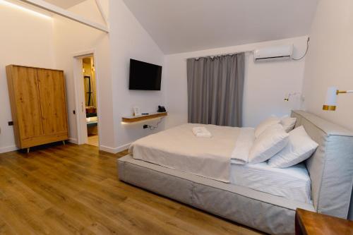 Postel nebo postele na pokoji v ubytování Hotel 5 HILLS DRAGASANI