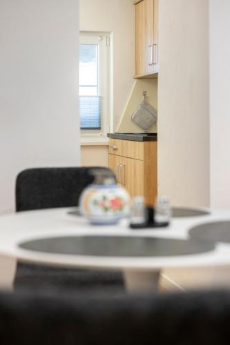 a kitchen with a table and a chair in a room at Defereggerhof St Veit in Defereggen in Feld