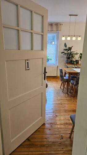 a door leading into a dining room with a table at Graniczna 21 - w Górach Sowich in Ober Wüstegiersdorf