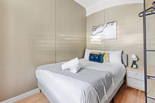 a bedroom with a bed with white sheets at Traditional Double Room in Glebe - Nearby USYD - Shared Bathroom in Sydney