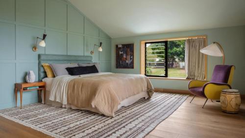 a bedroom with a large bed and a window at Cedar Hill in Newrybar