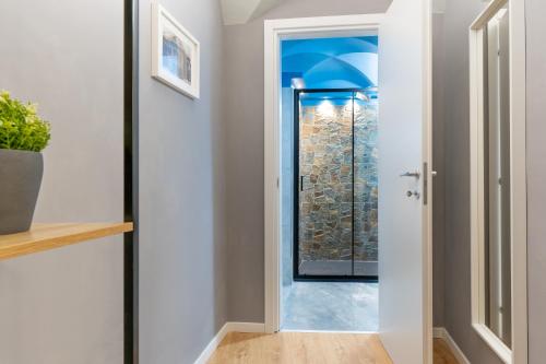 a hallway with a door leading to a window at Elephant and Castle - Exclusive Holiday Home in Catania