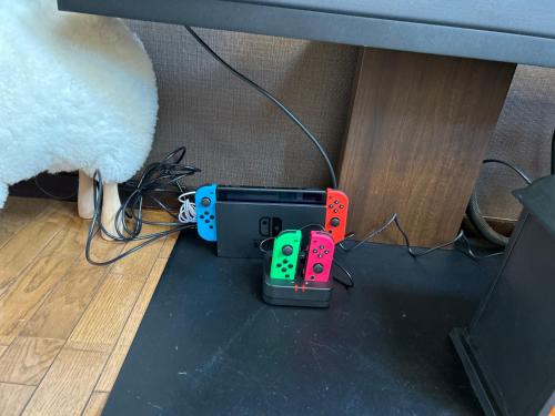 a table with two video game controllers on the floor at THE BLAUBAUM TOYA in Lake Toya