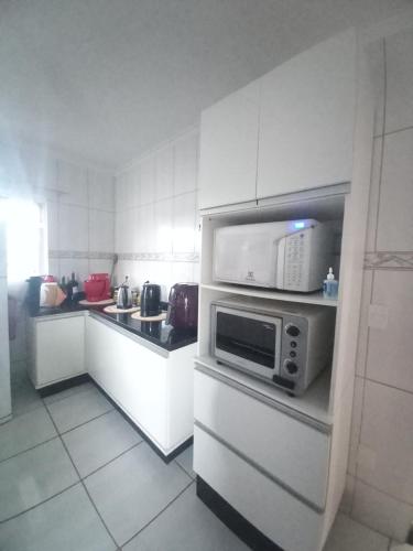 Dapur atau dapur kecil di Casa de praia com jacuzzi