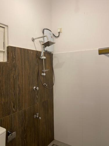 a shower with a shower head in a bathroom at VILLA 826 Ahungalla in Ahungalla