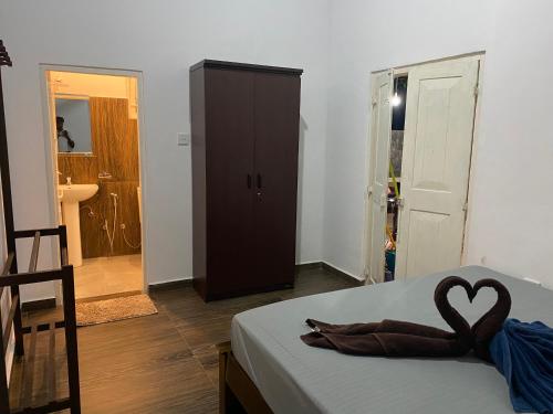 a room with a bed with a heart on it at VILLA 826 Ahungalla in Ahungalla