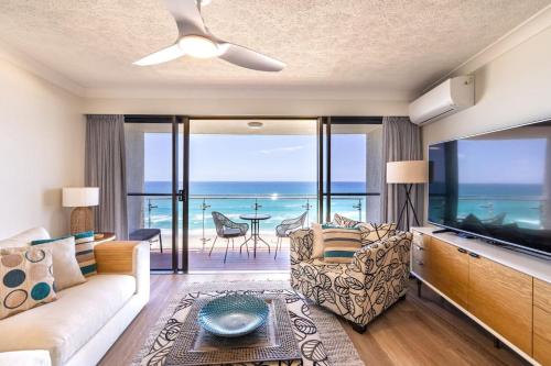 a living room with a view of the ocean at Ocean Front Escape on Palm Beach in Gold Coast