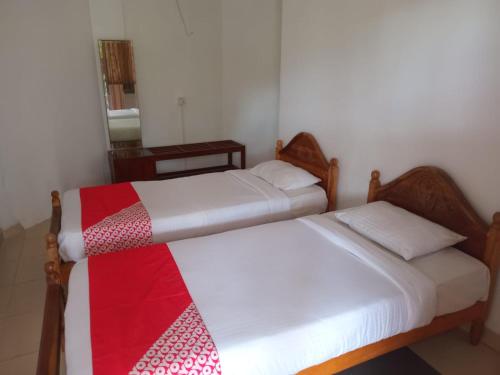 Ένα ή περισσότερα κρεβάτια σε δωμάτιο στο Blue Haven Guest House
