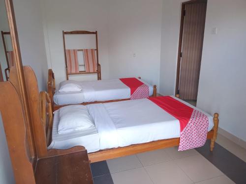 Ένα ή περισσότερα κρεβάτια σε δωμάτιο στο Blue Haven Guest House