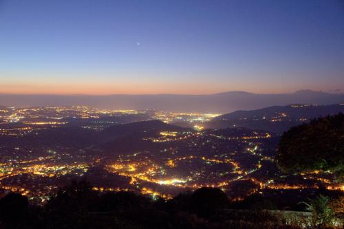 a view of a city at night at Domaine du Bois d'Amont in Cabris
