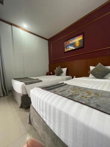 Postel nebo postele na pokoji v ubytování Lien Do Star Hotel