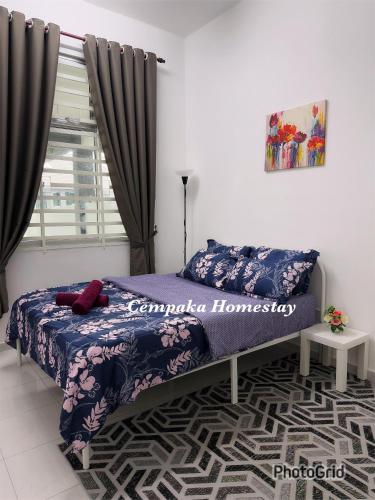 a bedroom with a bed and a window with curtains at Homestay Kulim, Cempaka Homestay Desa Kayangan in Kampong Padang Meha