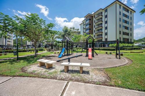 a park with a playground with a slide at 9-26 Costa Linda Jacó Beach pool view Balcony in Jacó