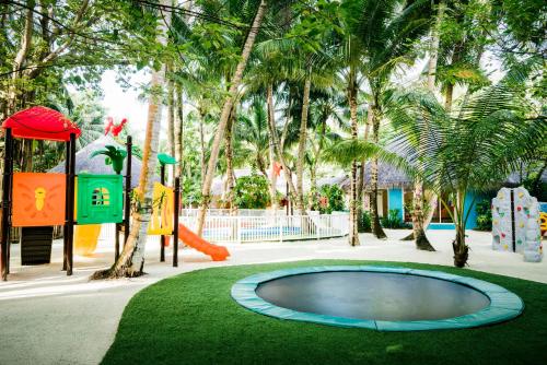 a playground with a small pool in a park at Niyama Private Islands Maldives in Dhaalu Atoll