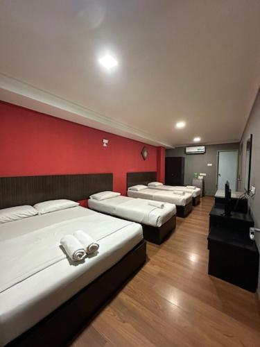 Postel nebo postele na pokoji v ubytování Li Garden Hotel