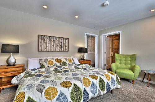 a bedroom with a bed and a green chair at The Forest Fun Suite - 2RM-2BA Condo, Pool, Bus, King Bed, 2 Sofa Beds, Fireplace, Ski Rental Deals in Killington