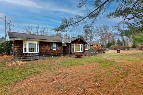 a house with a yard in front of it at Susan Lane Hideaway - 4BR, 3BA Renovated Home, Close to Skiing and Town, Fireplace in Rutland