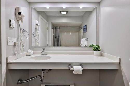 a bathroom with a sink and a large mirror at Ski Condo Close to the Resort, Shuttle Bus Route, Summer Pool, 2 Queen Beds in Killington