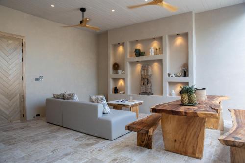 a living room with a couch and a table at Cielo Boutique Hotel & Spa Samui in Bophut 