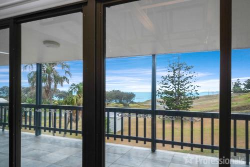 a view of the ocean from a room with windows at Rocky Retreat At Emu Park - 7 Connor Street Emu Park in Emu Park