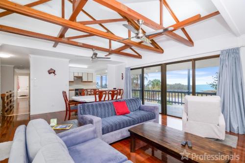 a living room with a couch and a table at Rocky Retreat At Emu Park - 7 Connor Street Emu Park in Emu Park