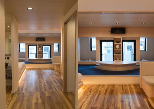 a bathroom with a tub in the middle of a room at UH Suite Namba Station in Osaka