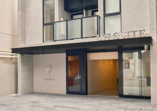 a store front of a building with its door open at UH Suite Namba Station in Osaka