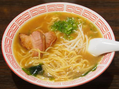 a bowl of soup with meat and noodles on a table at Tabist Nanki Shirahama Ryokan Mantei in Shirahama