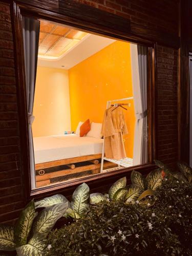 a room with a bed and a large window at Tam Coc Golden Fields in Ninh Binh